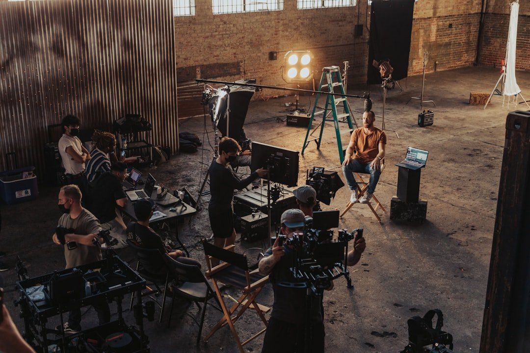 Video production crew working around a professional camera